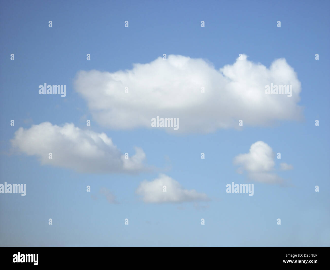 Blue Skies and White Fluffy Clouds Stock Photo