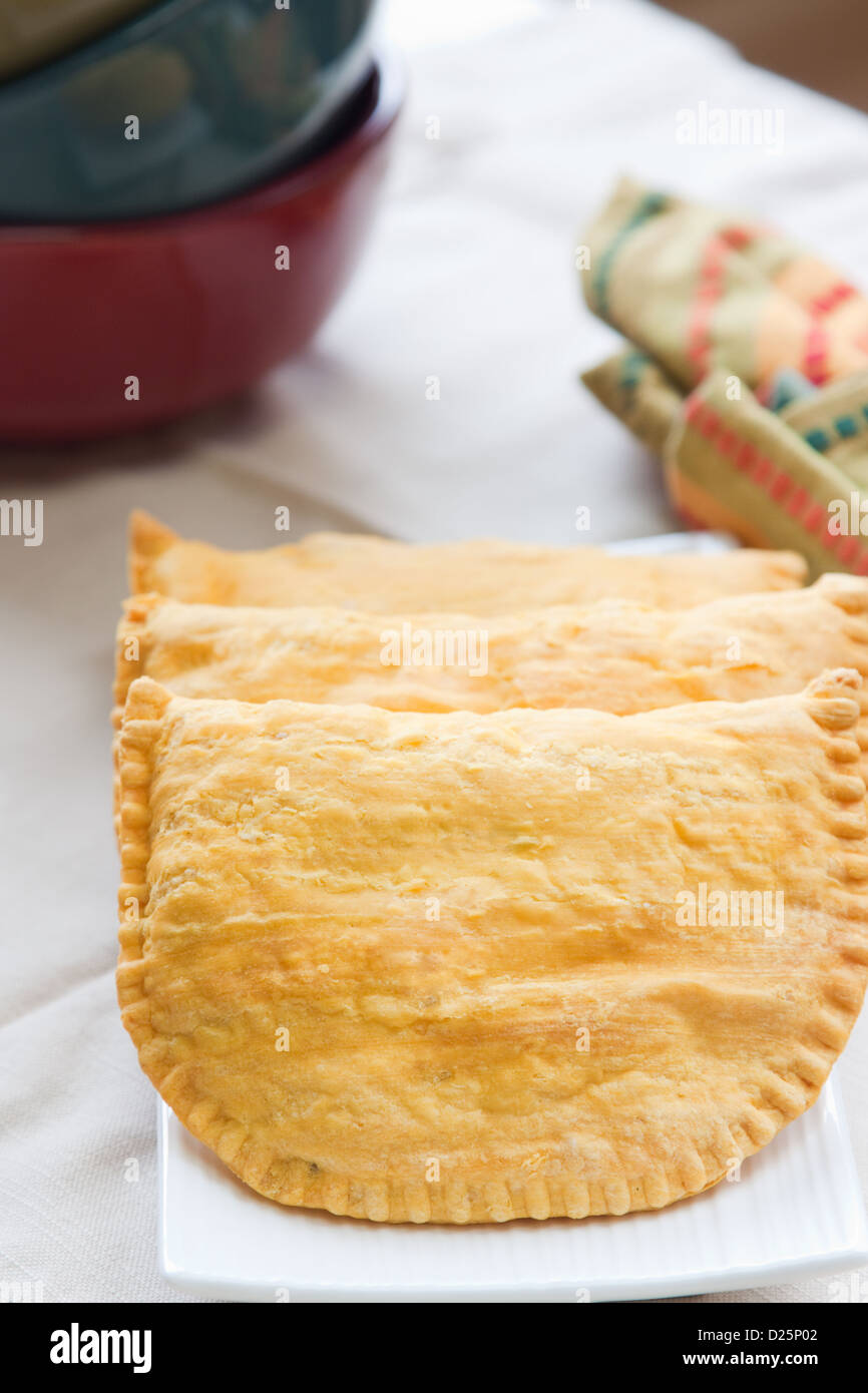 Three Jamaican beef patties on a plate Stock Photo