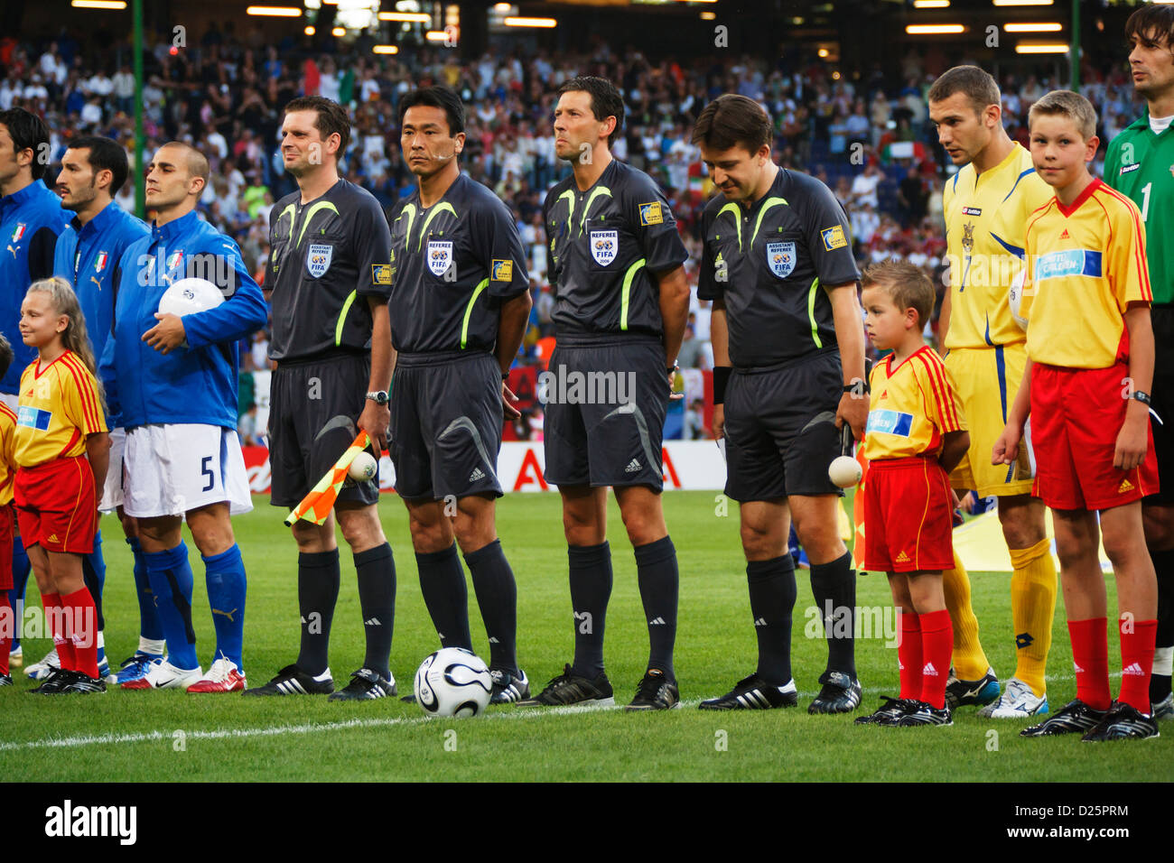 The officiating team and players from Italy and Ukraine line up before a 2006 FIFA World Cup quarterfinal match. Stock Photo