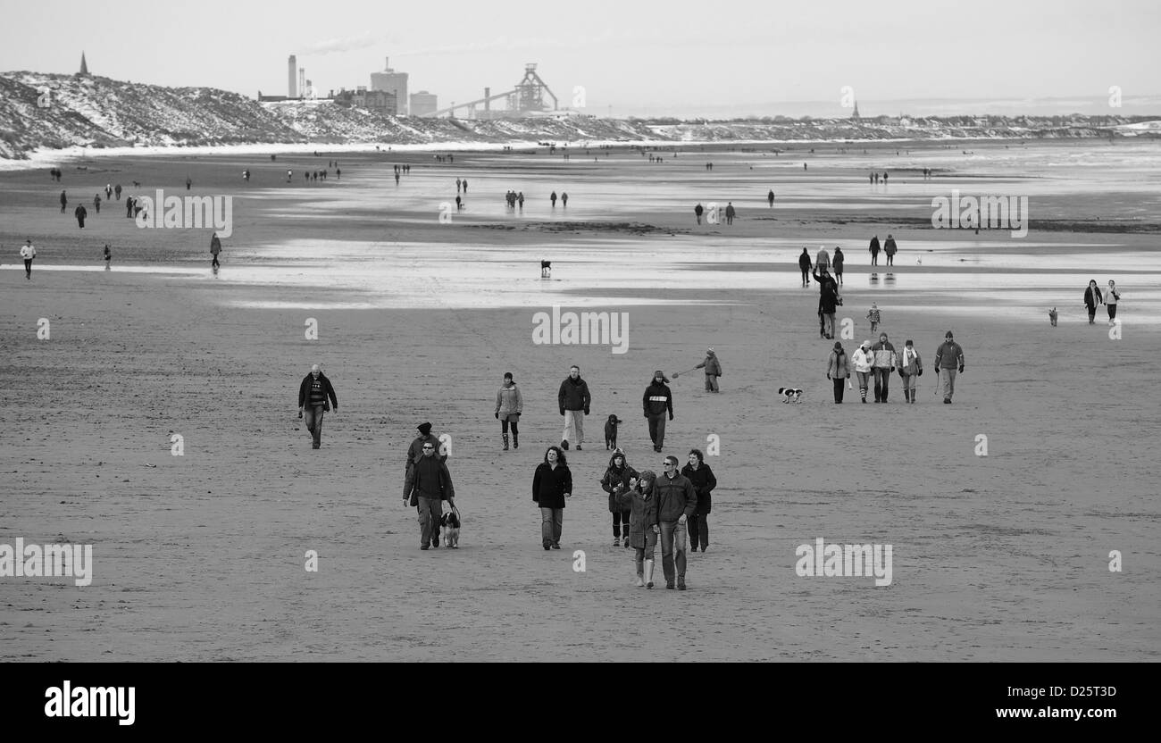The beach between Saltburn and Marske is filled with walkers enjoying the fresh air on Boxing Day. Stock Photo