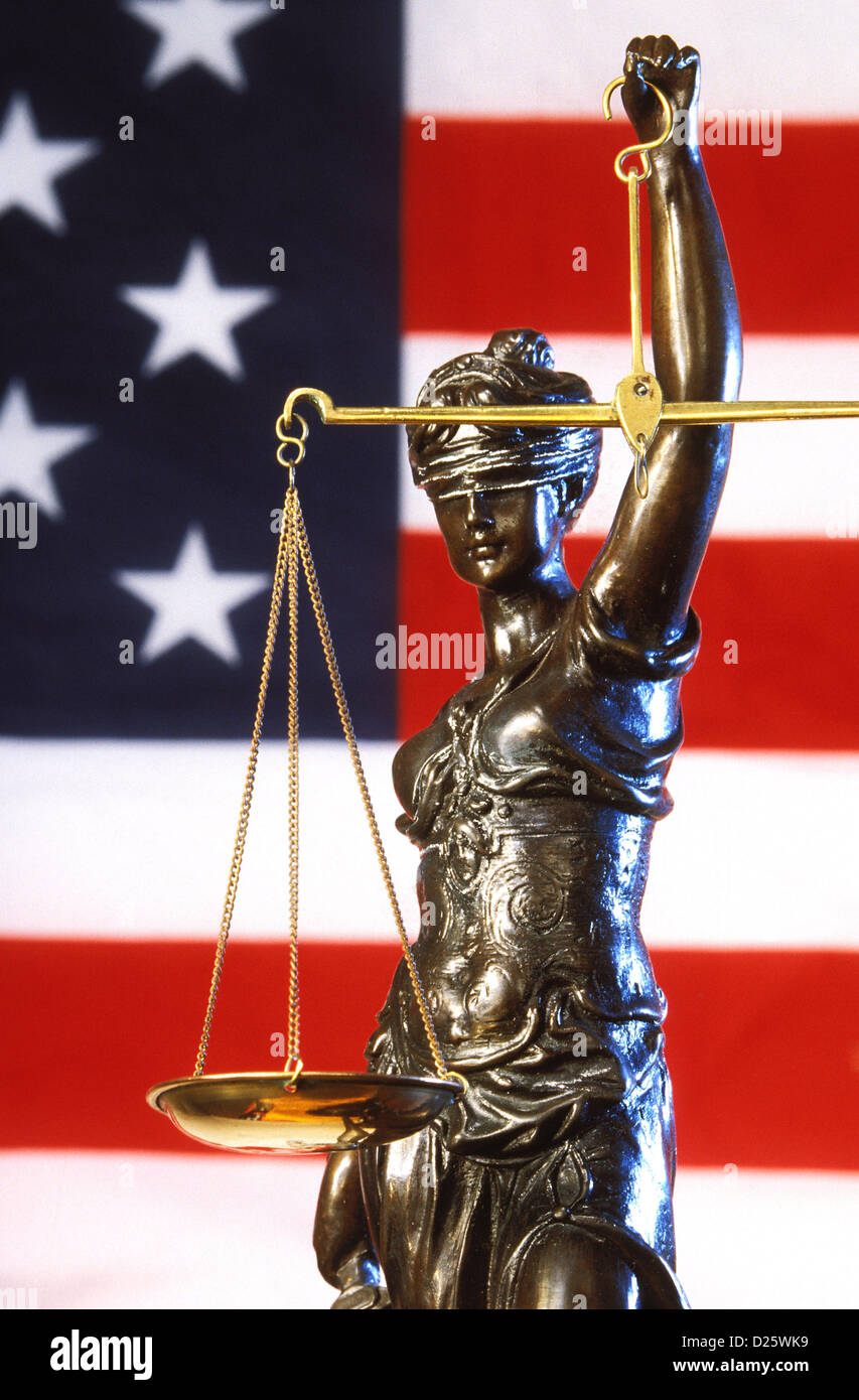 Justice Statue & American Flag Stock Photo