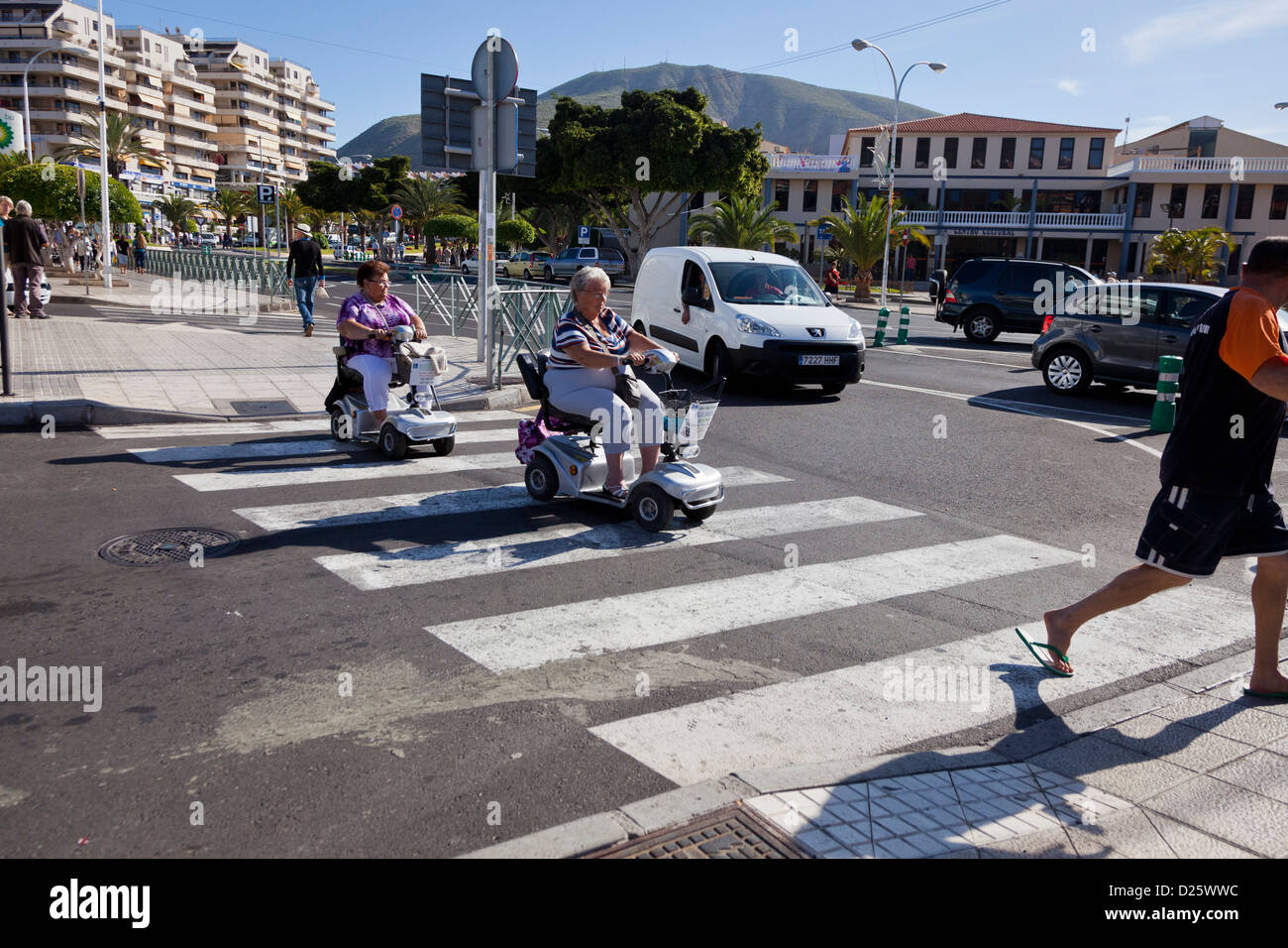 Disabled scooters on pedestrian crossing in Los Cristianos, Tenerife