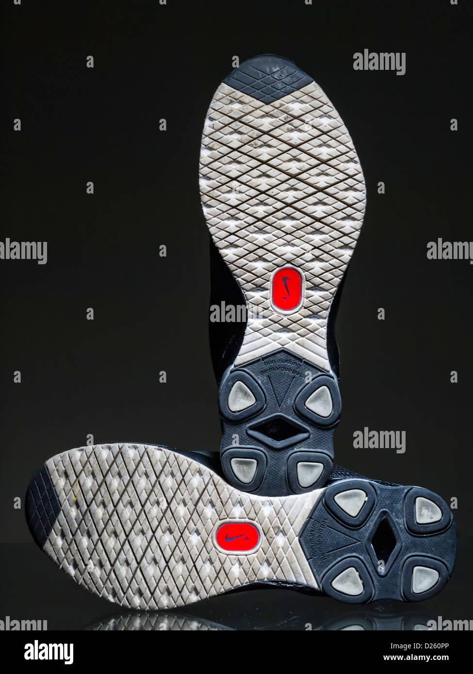 Nike+ sensor logo on running shoes' soles Stock Photo - Alamy