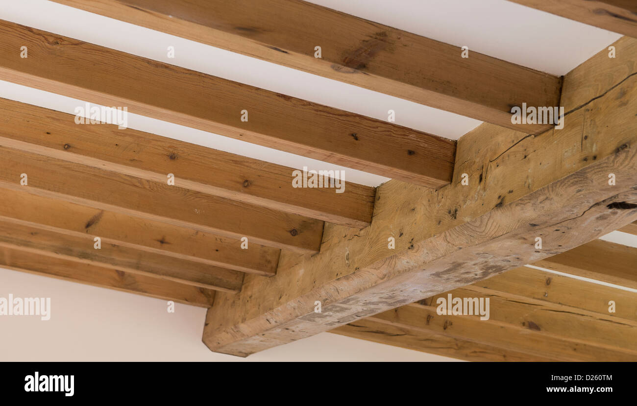 Beautiful traditional wooden beams in a newly converted barn in rural England. Stock Photo