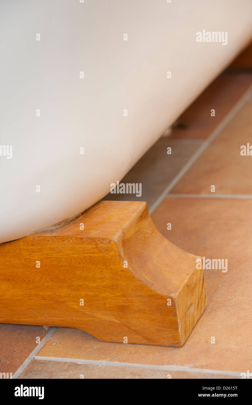 Beautiful wooden blocks being used as feet for a freestanding bath in a