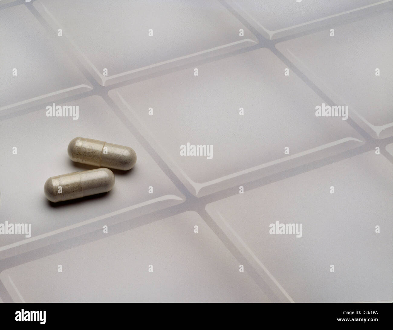 Pills on tile Stock Photo