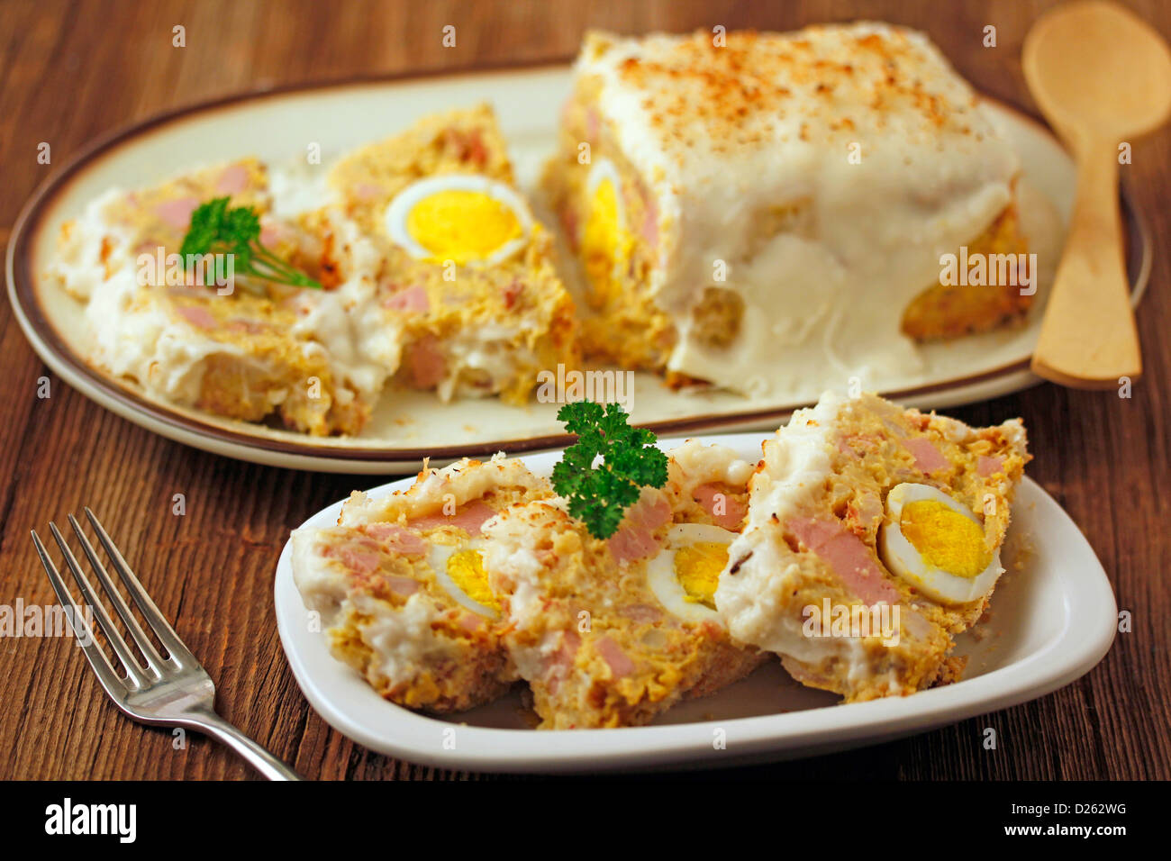 Meat terrine with potatoes and eggs. Stock Photo