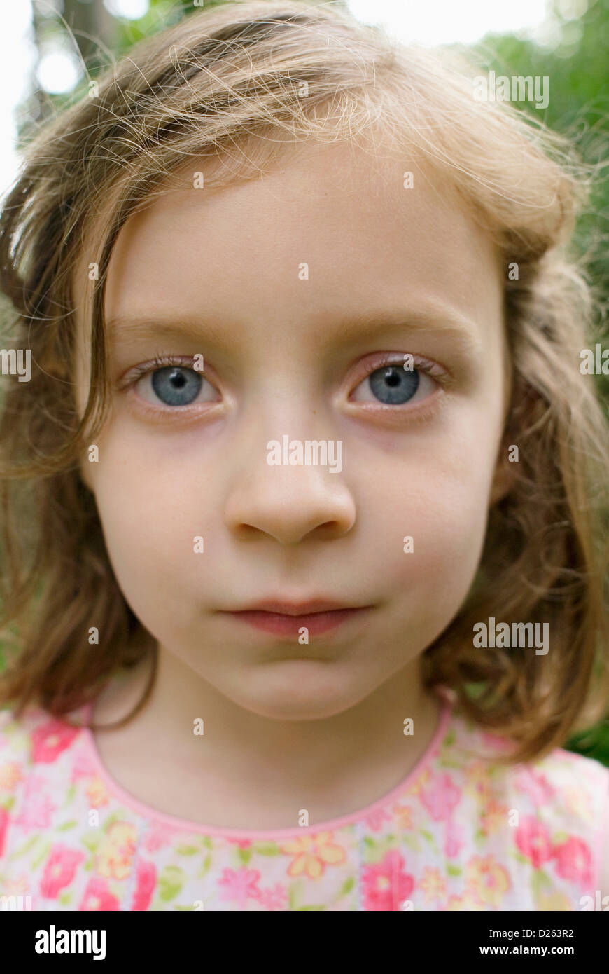 a young girl looking at the camera Stock Photo - Alamy
