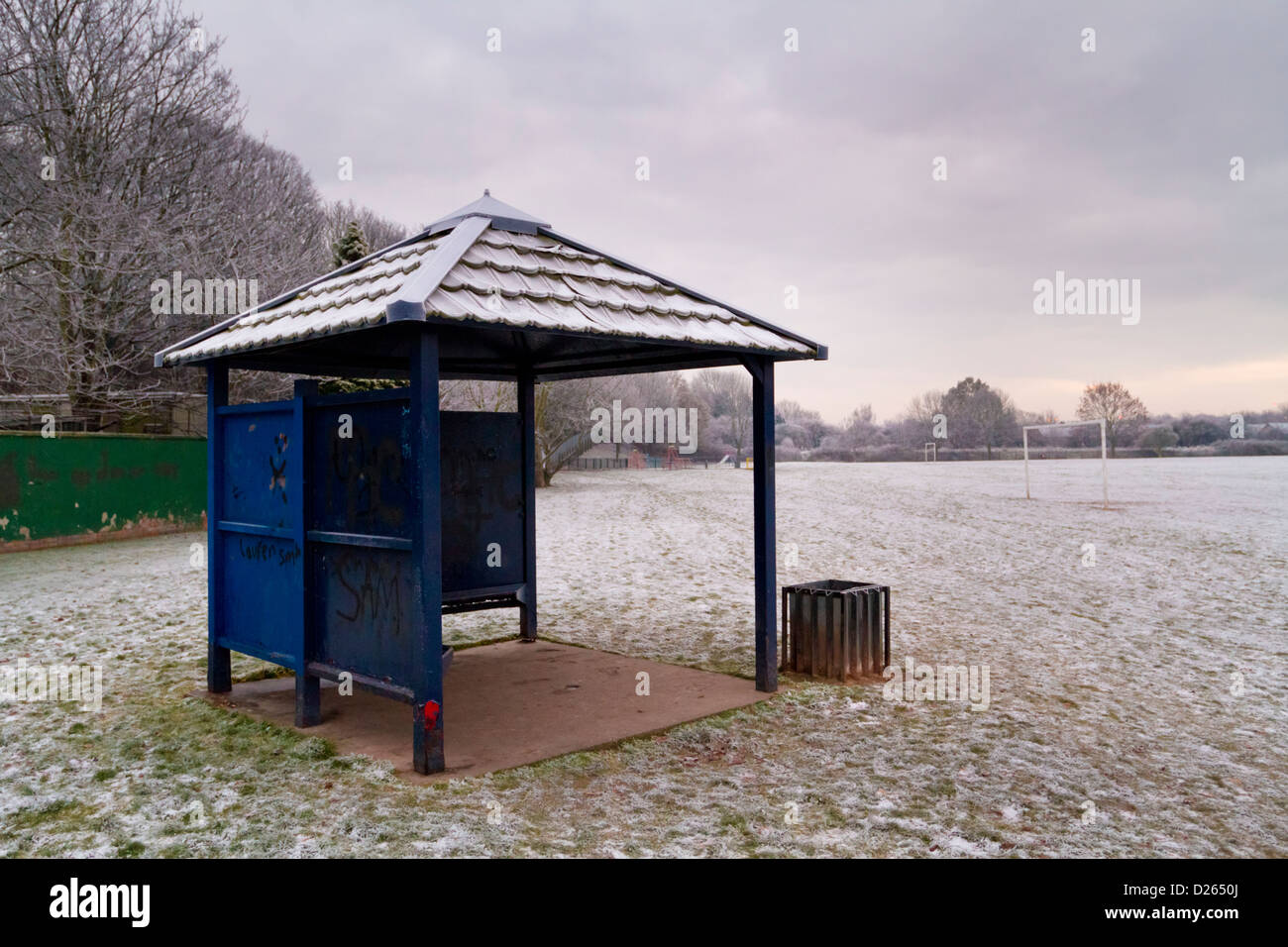 A cold snow covered shelter in an empty public park in winter, Nottinghamshire, England, UK Stock Photo