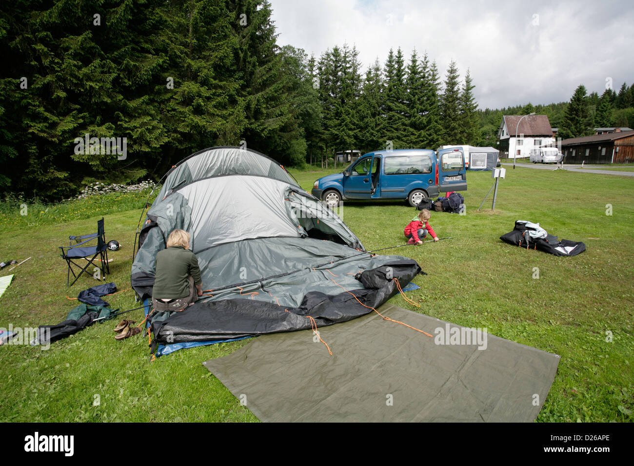 Braunlage, Germany, a woman sets up a tent for camping Stock Photo - Alamy