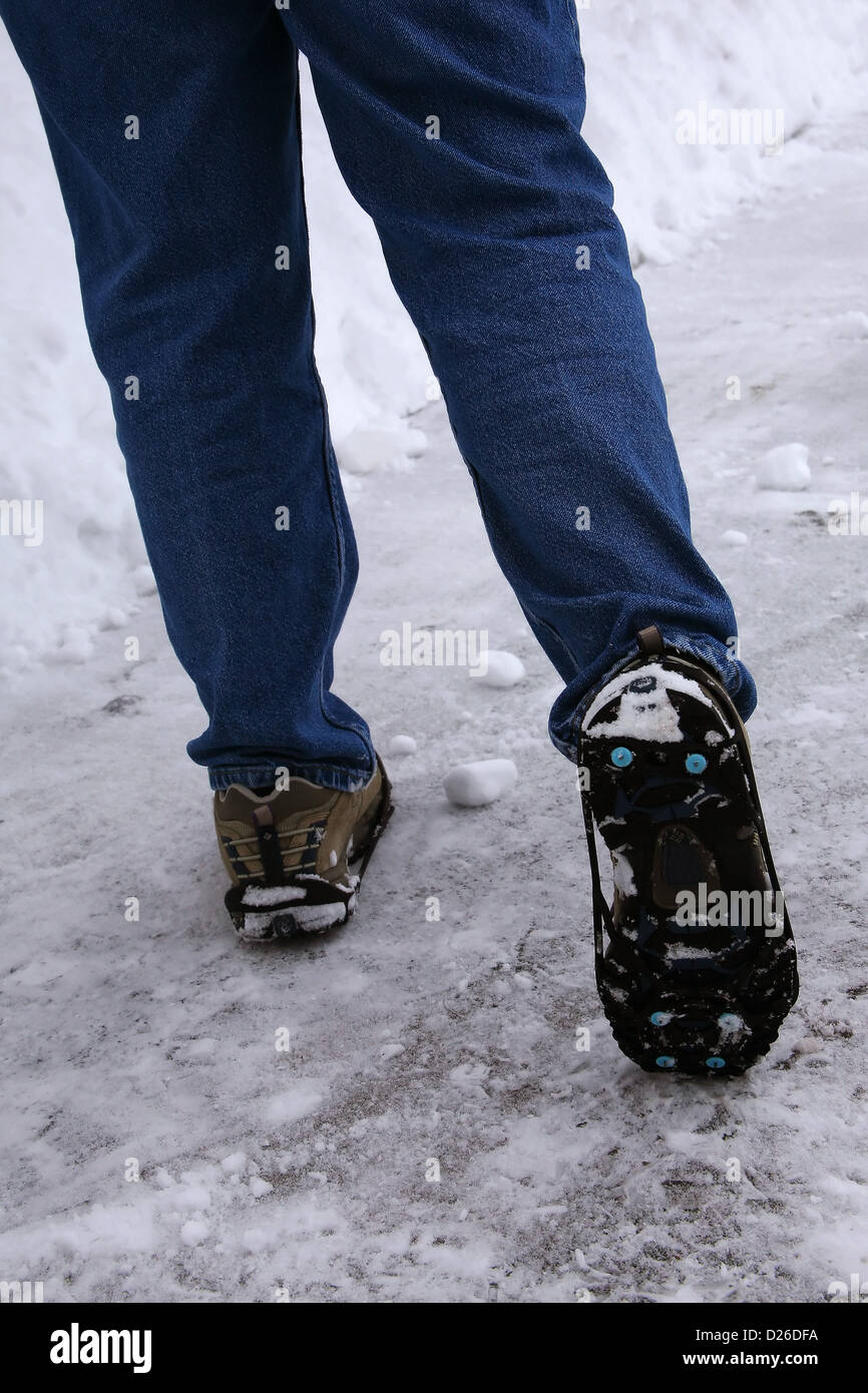 Safely walking on icy slope Stock Photo