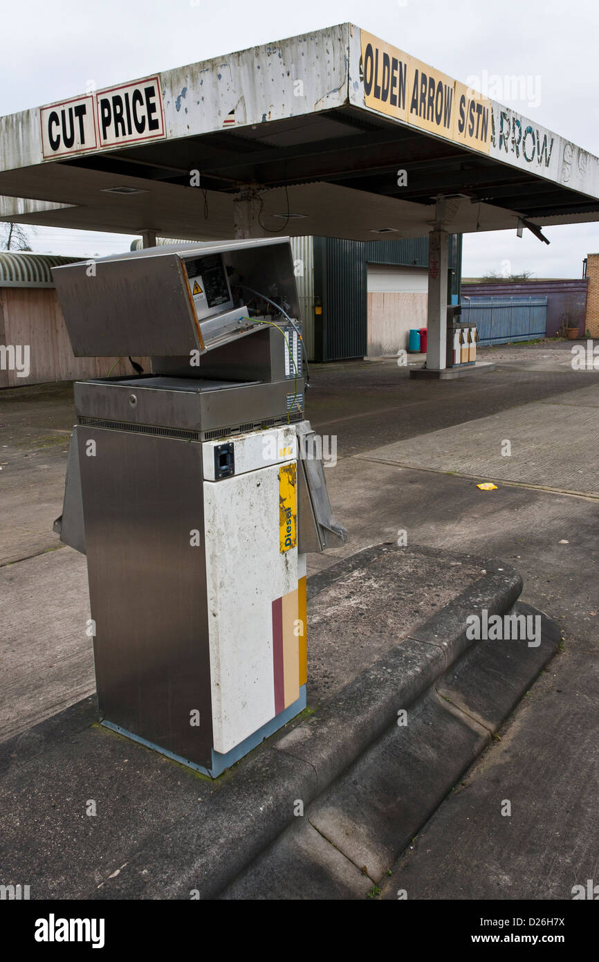 Broken petrol pump in abandoned, derelict filling station, closed for business. Stock Photo