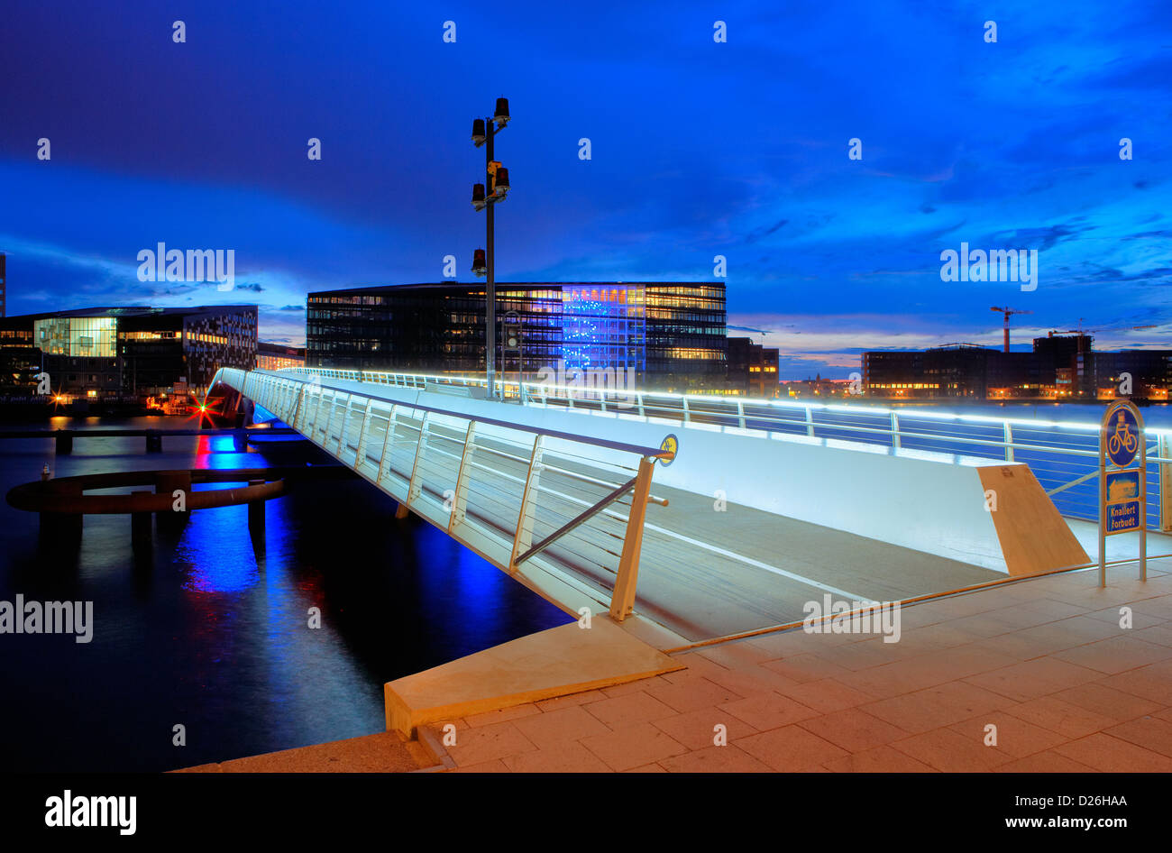 Copenhagen, Denmark, illuminated bridge at Islands Brygge evening Stock