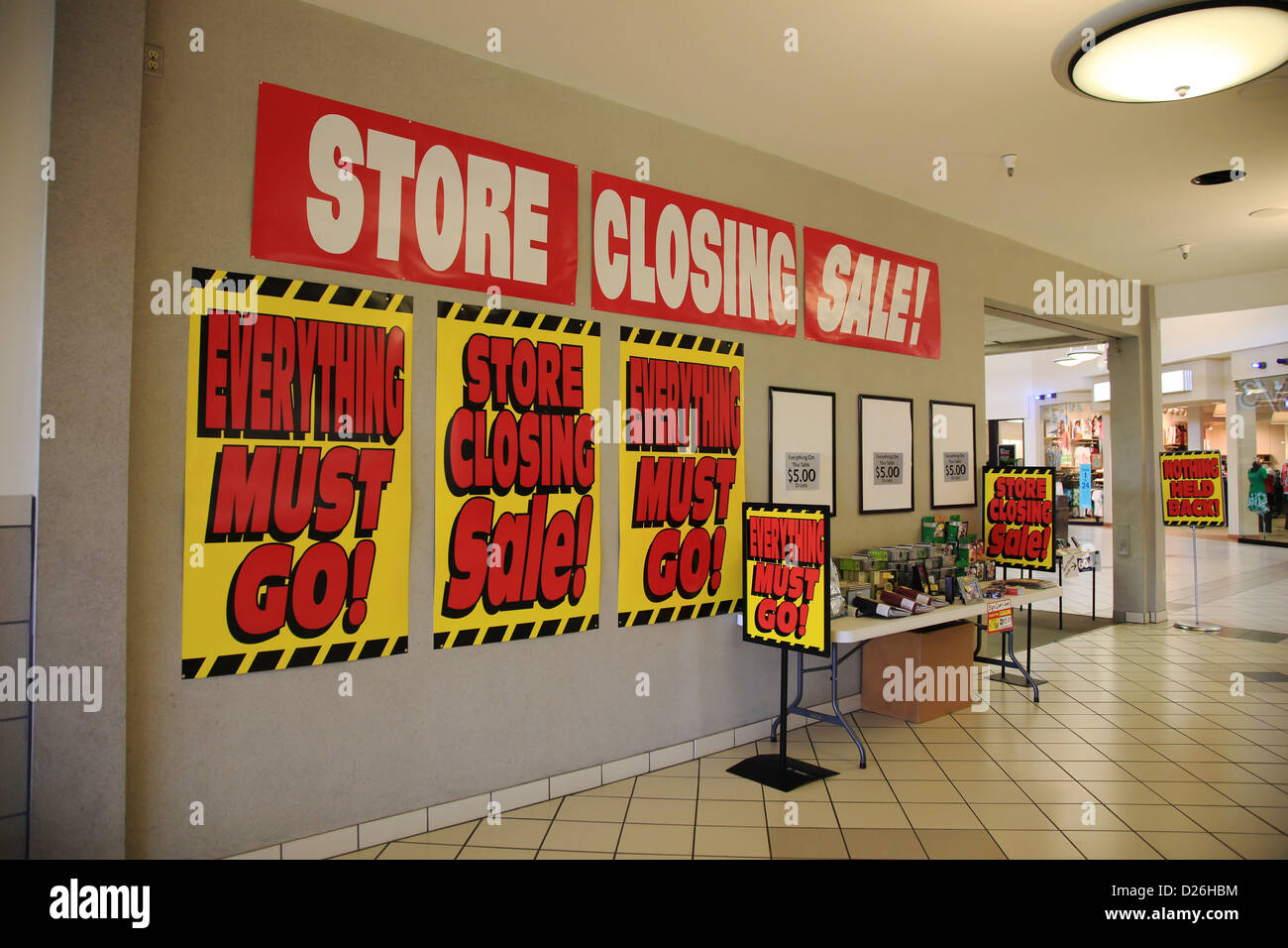 Store closing signs in mall Stock Photo