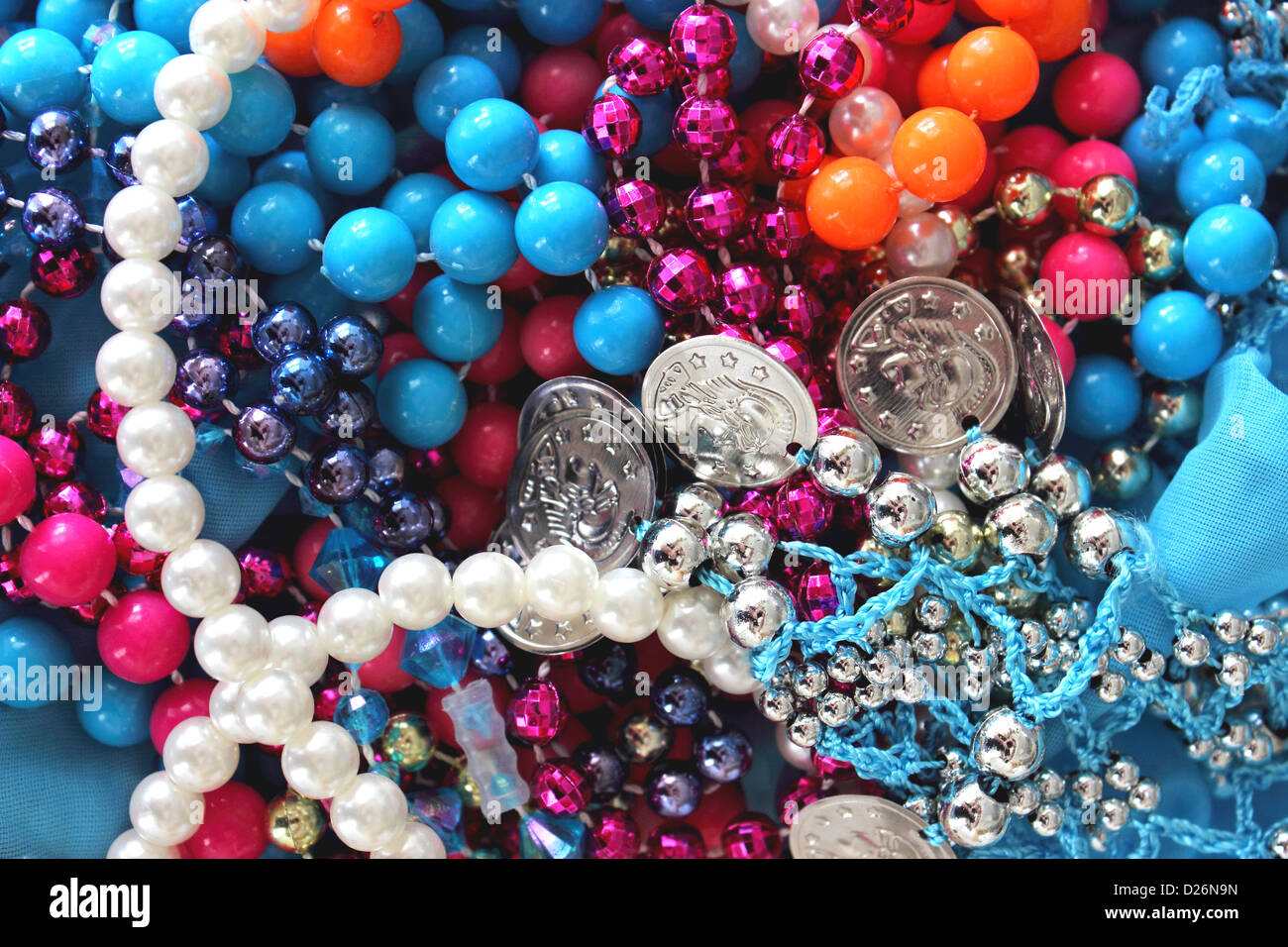 A colorful pile of Mardi Gras beads and bangles Stock Photo