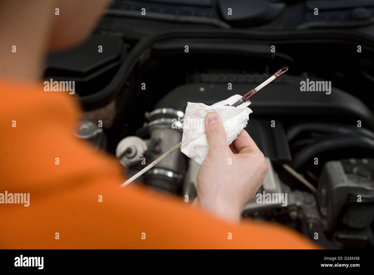 Euskirchen, Germany, a relief teacher checks the oil level at a gas station Stock Photo Alamy