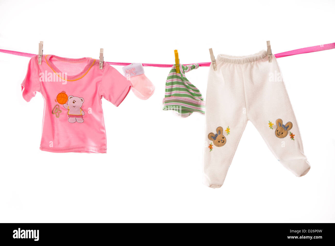 Baby clothes and clothesline Cut Out Stock Images & Pictures - Alamy