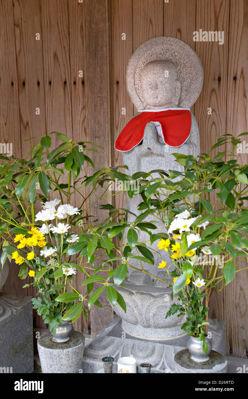 Stone carved Jizo statue in roadside shrine near Takeda Japan Stock
