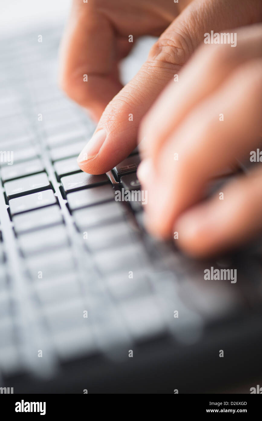 Vertical shot male typing hi-res stock photography and images - Alamy