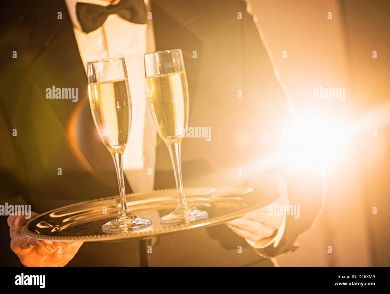 USA, New Jersey, Jersey City, Waiter holding tray with champagne Stock Photo