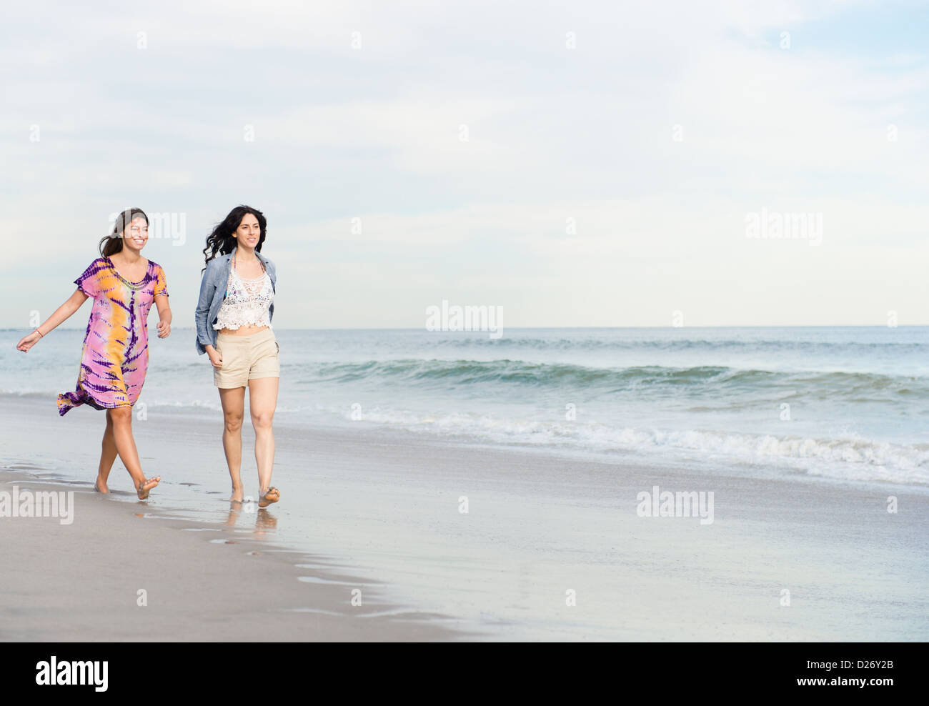 USA, New York State, Rockaway Beach, Two women walking on beach Stock Photo