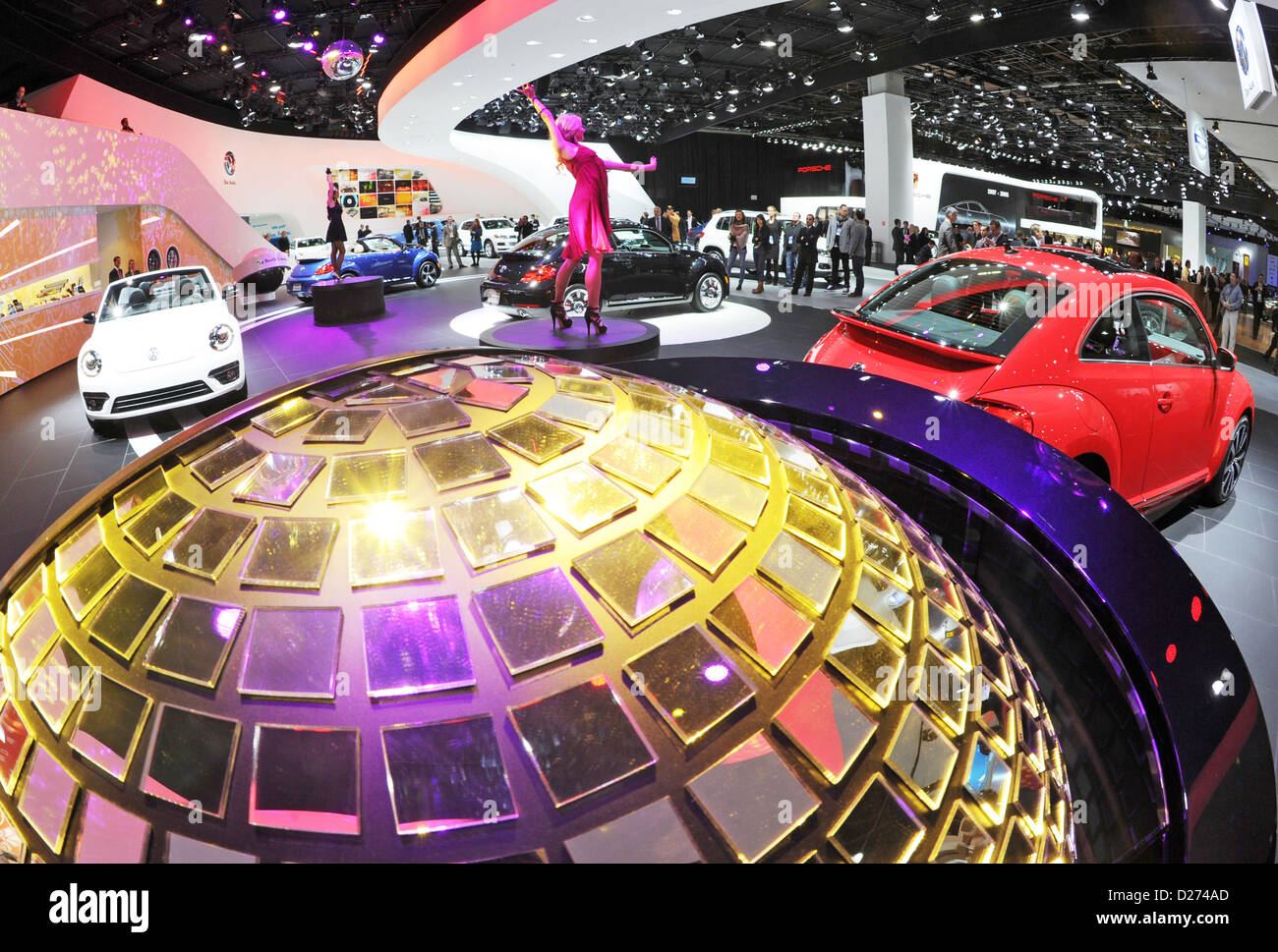 Models stands at the stand of VW on the second press day at the North American International Auto Show (NAIAS) in Detroit, USA, 15 January 2013. NAIAS opened officially on 14 January 2013 for press and dealers and is open for the general public from 19 January to 27 January 2013. Photo: ULI DECK Stock Photo