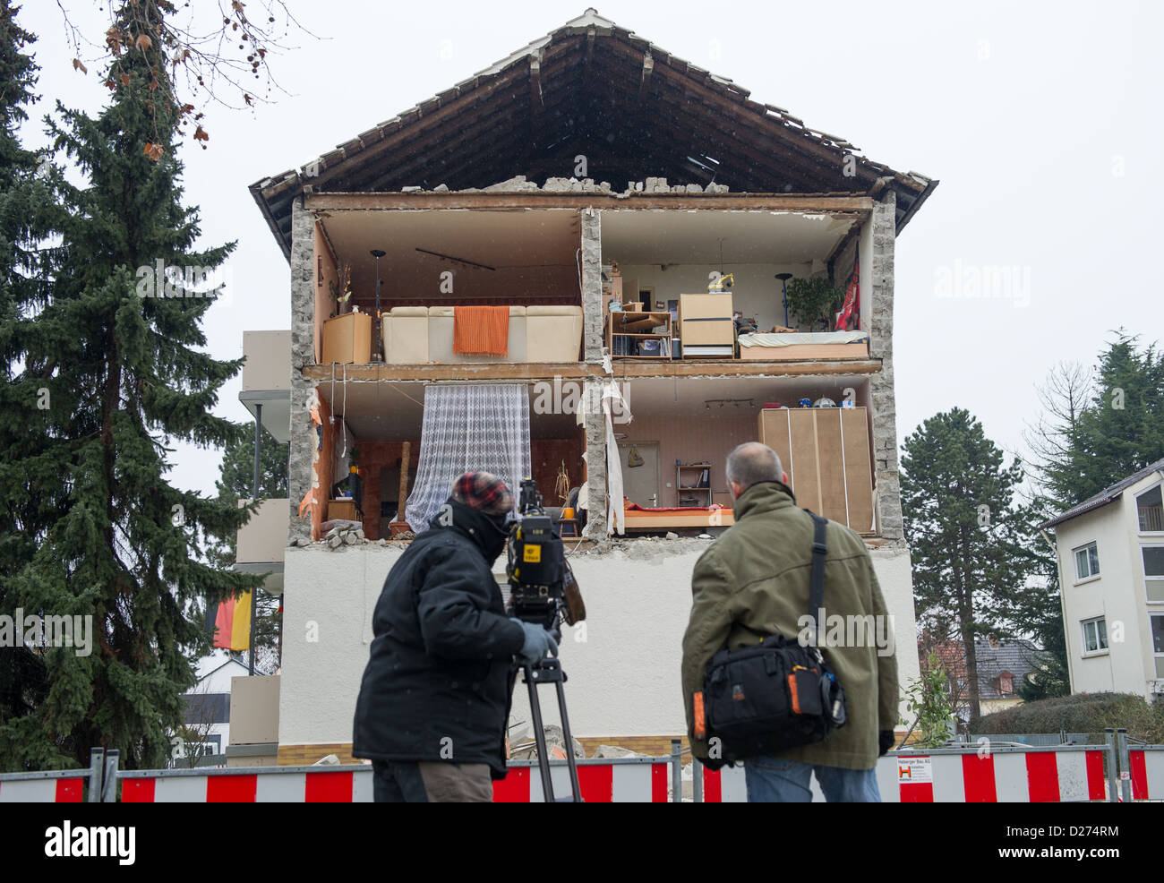 A television crew films an apartment building whose facade has collapsed in Frankenthal, Germany, 15 January 2013. The cause of the complete collapse of the facade is unknown at the moment, but the residents were not injured. Photo: UWE ANSPACH Stock Photo