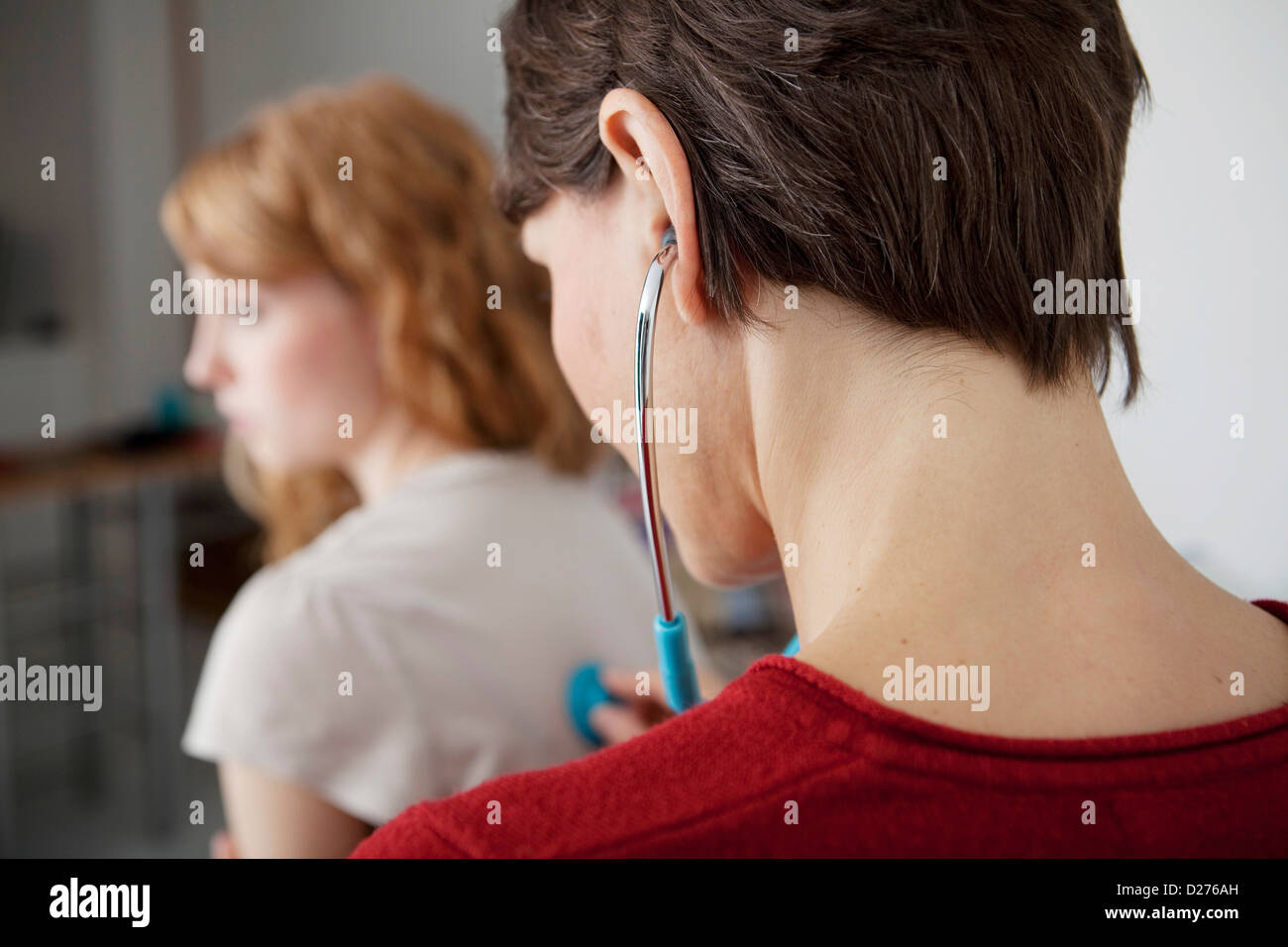 AUSCULTATION, WOMAN Stock Photo