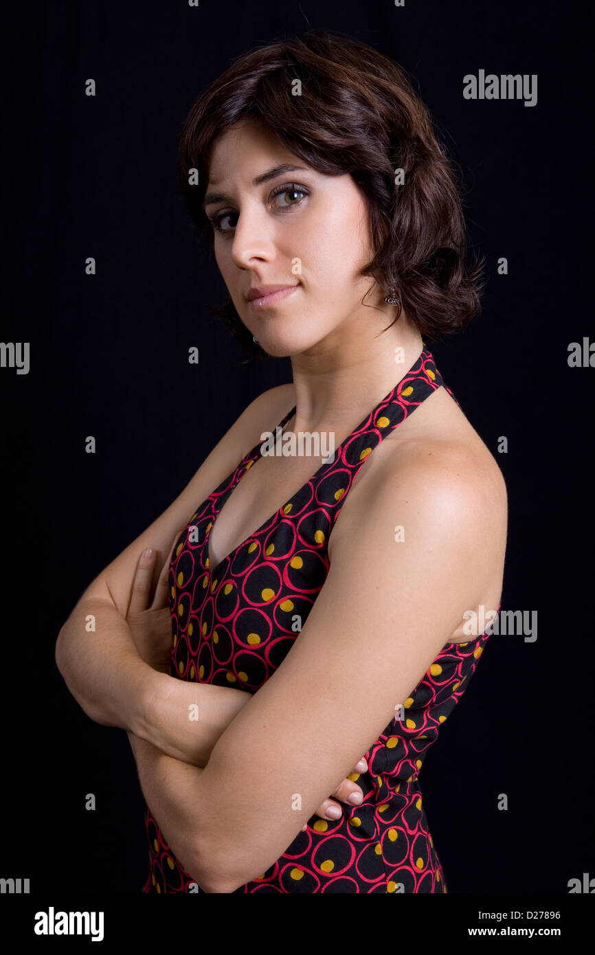 young beautiful brunette portrait against black background Stock Photo ...