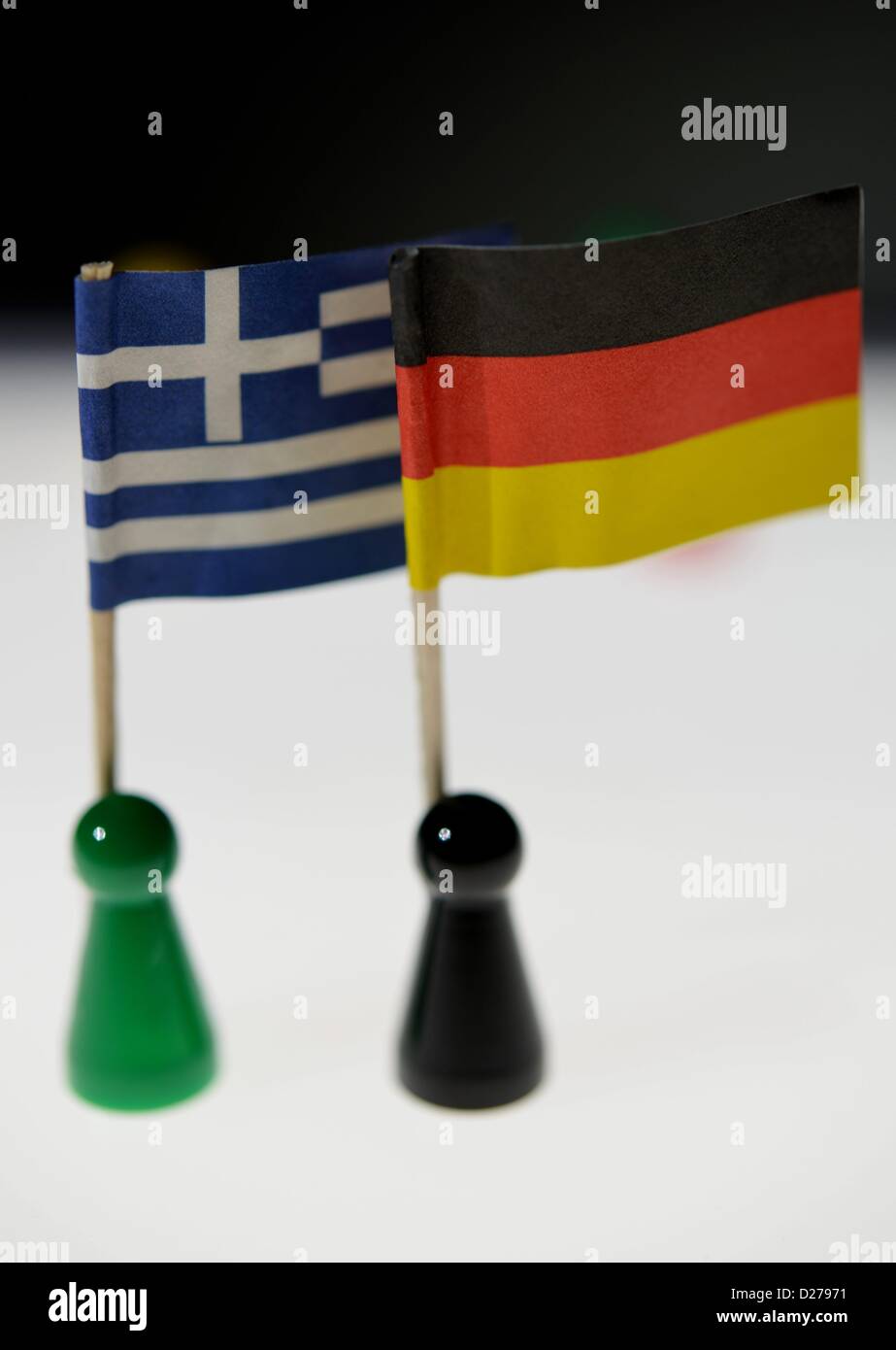 Pawns of a game standing on a table. Photo: Frank May Stock Photo