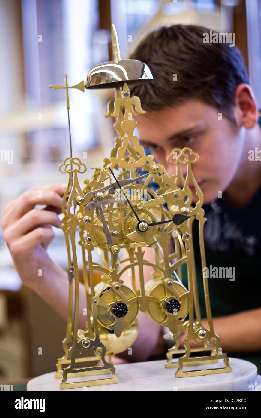 Student restoring antique clock at West Dean College, Chichester, West