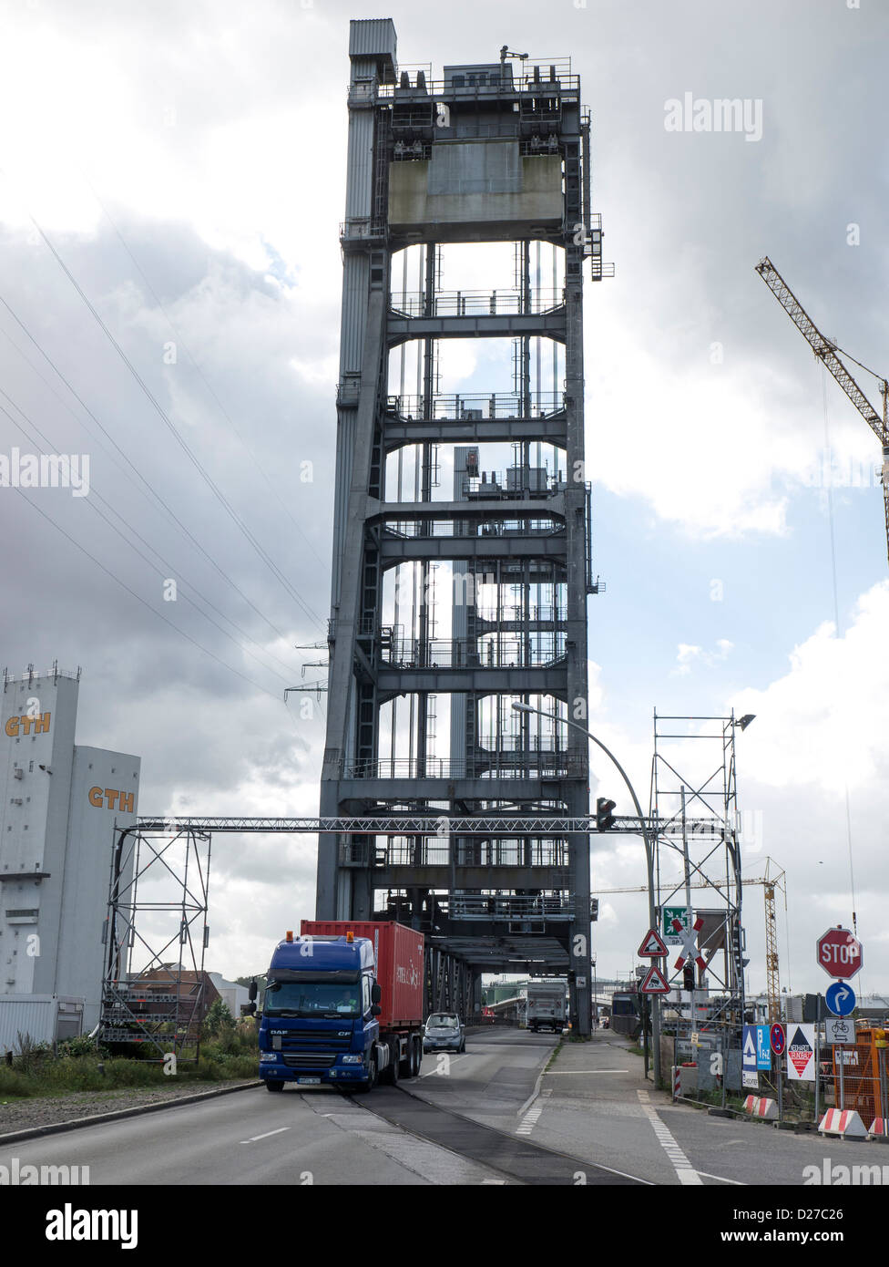 Container truck crossing the lift bridge on Rethedamm in the Port of Hamburg, Germany. Stock Photo