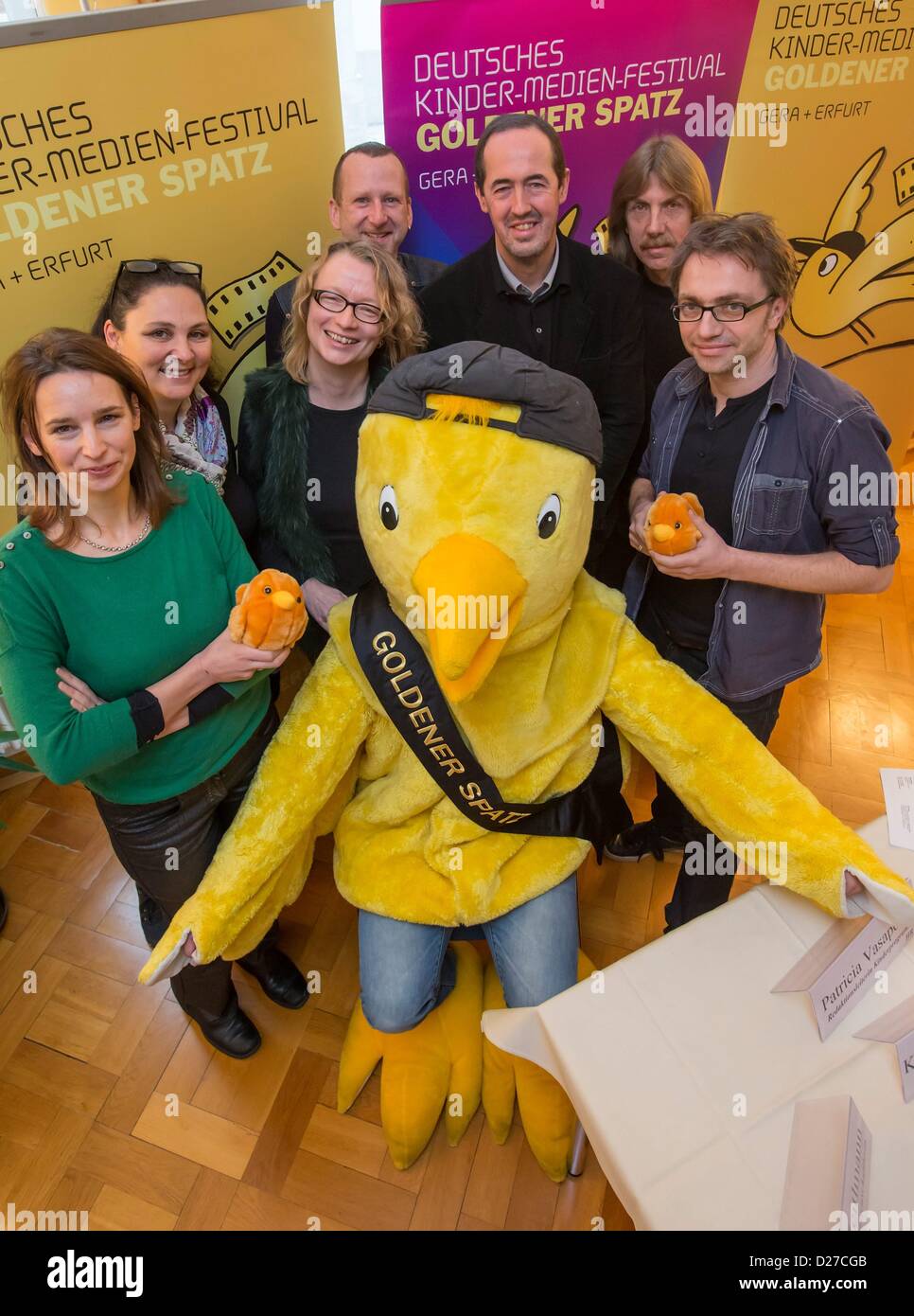 Erfurt, Germany. 16th January 2013. Jury members Brigitte Zeitlmann (L-R), Patricia Vasapollo, Margret Albers, Karsten Blumenthal, Frank Klasen, Hans Vavra and Leopold Gruen pose for photographs with the mascot of the children's film and television festival 'Golden Sparrow' in Erfurt, Germany, 16 January 2013. The festival takes place from 26 May until 01 June. Photo: MICHAEL REICHEL Stock Photo