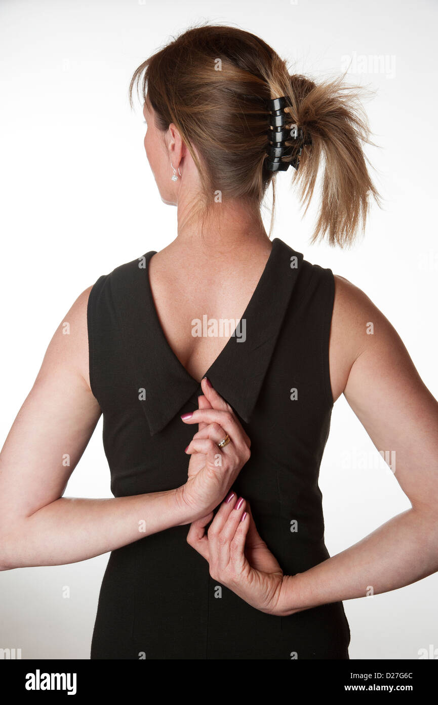 Woman pulling the zip fastener up or down on her little black dress