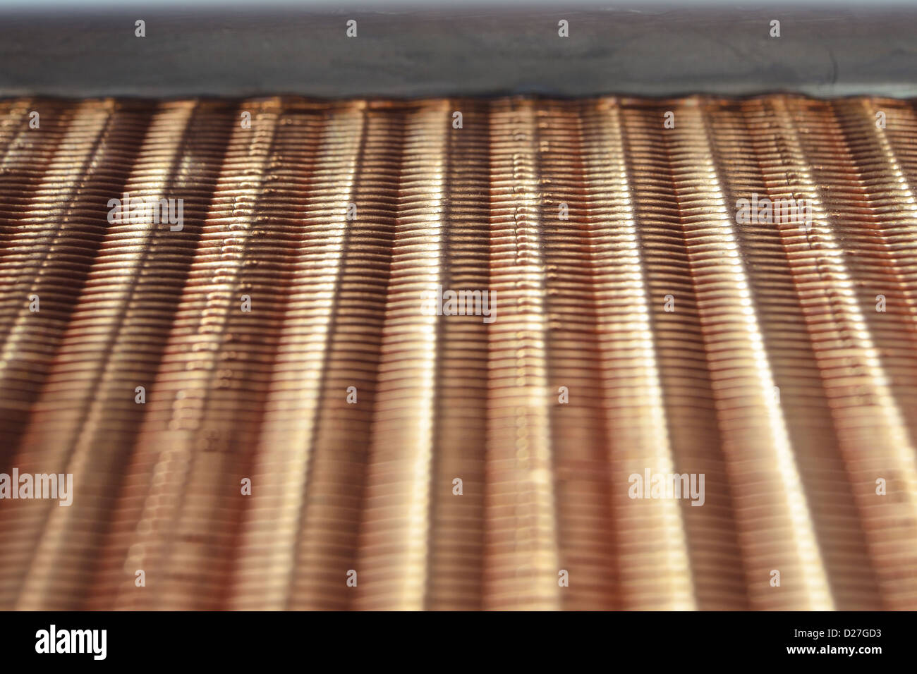 fragment of industrial copper air heat exchanger: focus on top part of radiator Stock Photo
