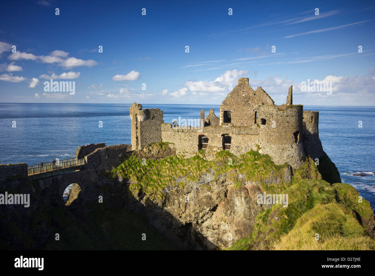 Dunluce Castle  - a famous landmark from the coast of Northern Ireland - on a beautiful sunny afternoon. Stock Photo