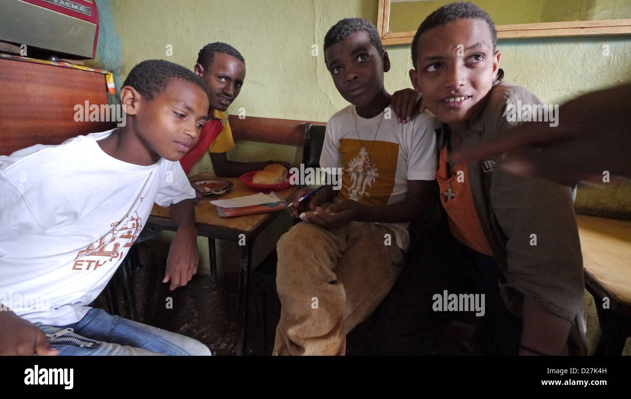 ETHIOPIA The 'Salam Cafe' in Chagni, Beni Shangul Gumuz region. Boys having breakfast. Stock Photo