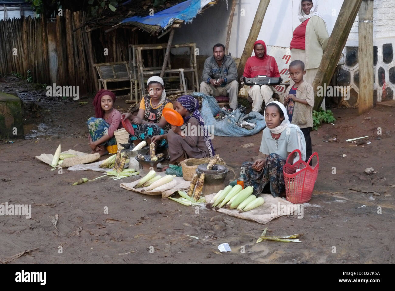 ETHIOPIA Street scenes on a rainy day in Chagni. Women selling corn. Stock Photo