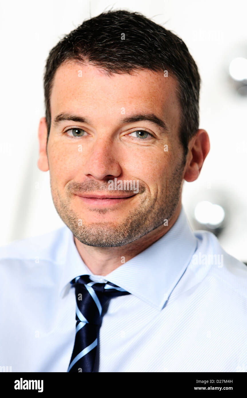 An attractive business man in a light business environment Stock Photo
