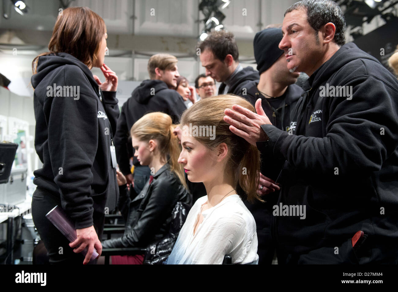 A model gets her hair done before the Anja Gockel show during the Mercedes-Benz Fashion Week in Berlin, Germany,15 January 2013. The presentations of the autumn/winter 2013/2014 collections take place from 15 to 18 January 2013. Photo: Maurizio Gambarini/dpa Stock Photo