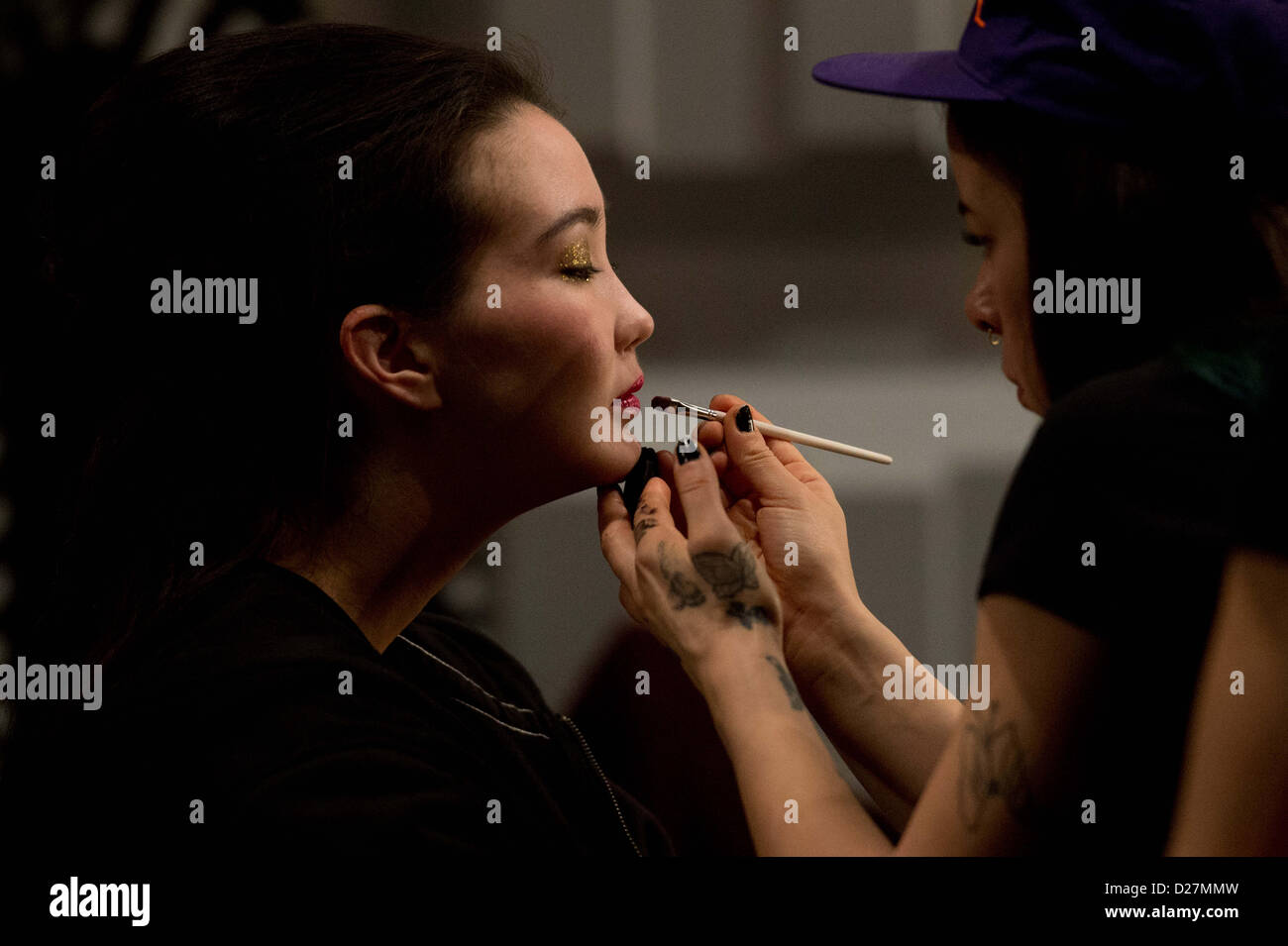 A model gets her lips done before the Anja Gockel show during the Mercedes-Benz Fashion Week in Berlin, Germany,15 January 2013. The presentations of the autumn/winter 2013/2014 collections take place from 15 to 18 January 2013. Photo: Maurizio Gambarini/dpa Stock Photo