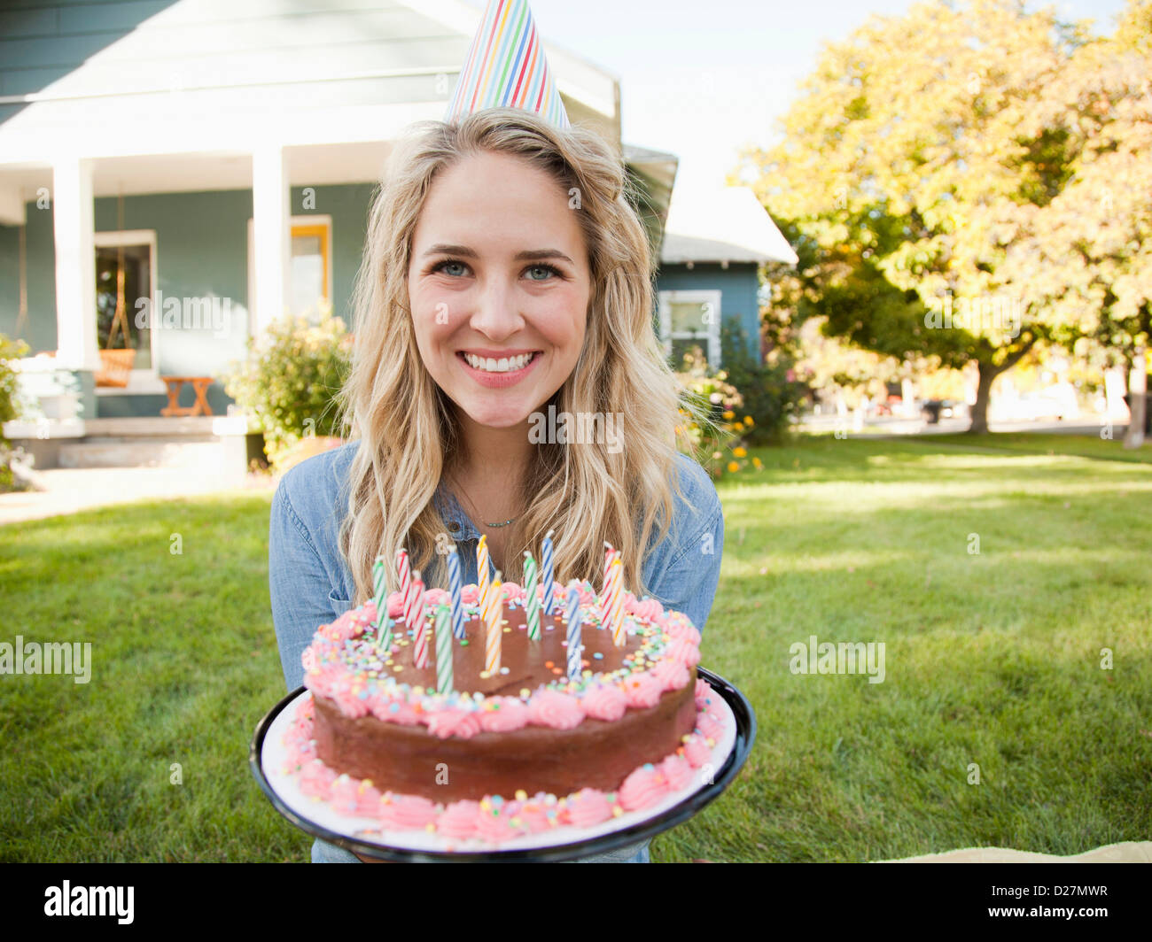 USA, Utah, Provo, Portrait of young woman holding birthday cake Stock ...