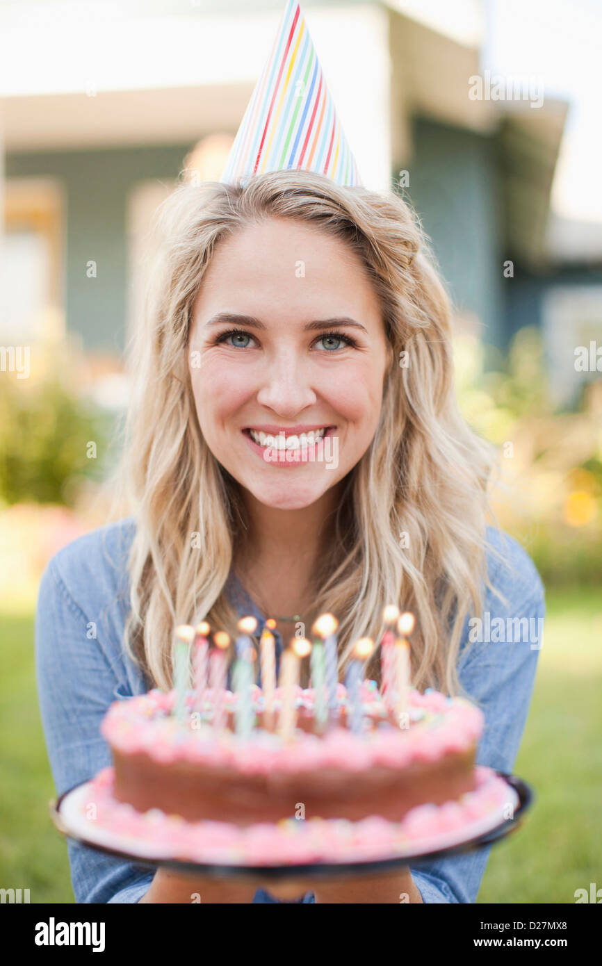 USA, Utah, Provo, Portrait of young woman holding birthday cake Stock ...