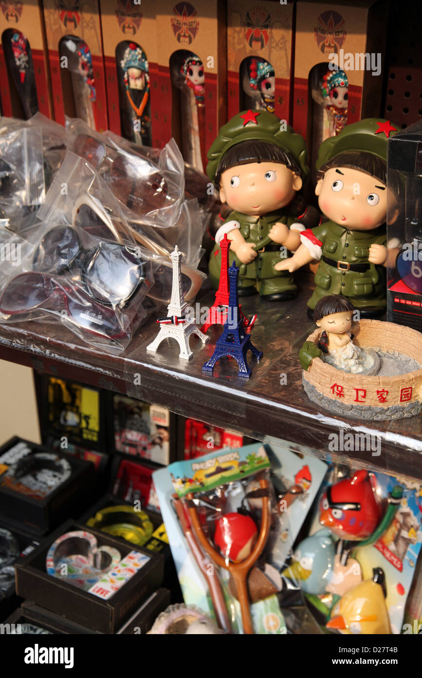 It's a photo of a souvenir shop in China. We can see Chinese dolls in soldier uniform like the red army. We can see Eiffel Tower Stock Photo