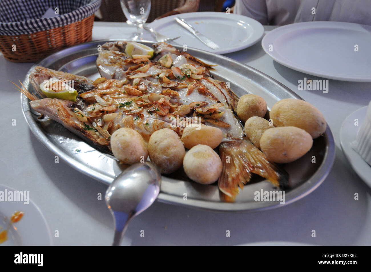 Grilled fish platter with potatoes Stock Photo Alamy