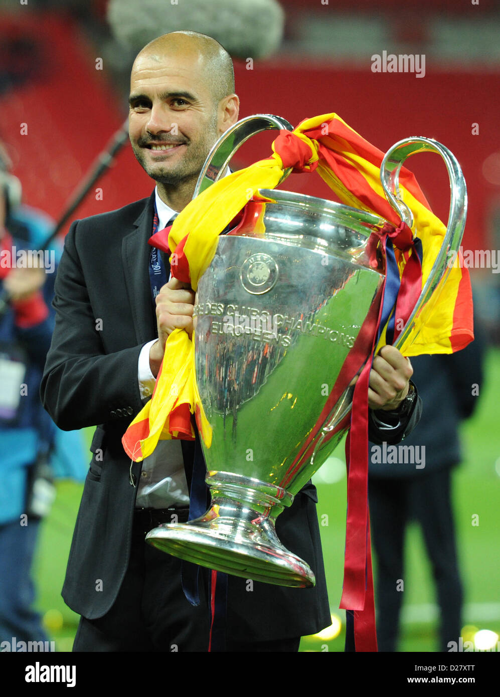Barcelona's head coach Josep Guardiola holds the Champions League trophy  after the Champions League Finale match FC Barcelona vs. Manchester United  in London, Great Britain, 28 May 2011. Photo: Revierfoto Stock Photo - Alamy