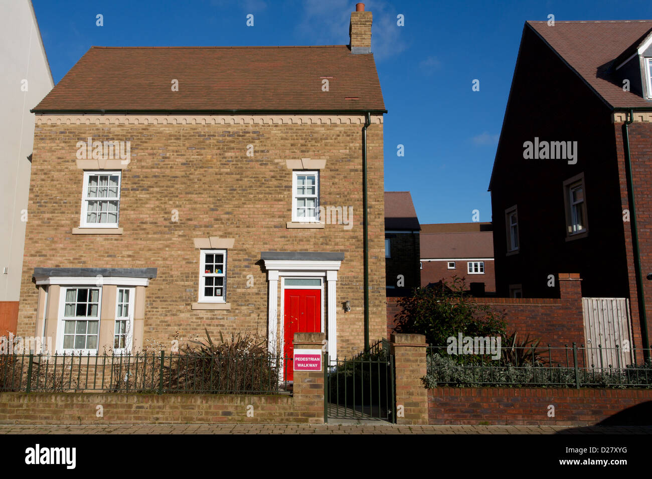 New detached house with red door Stock Photo