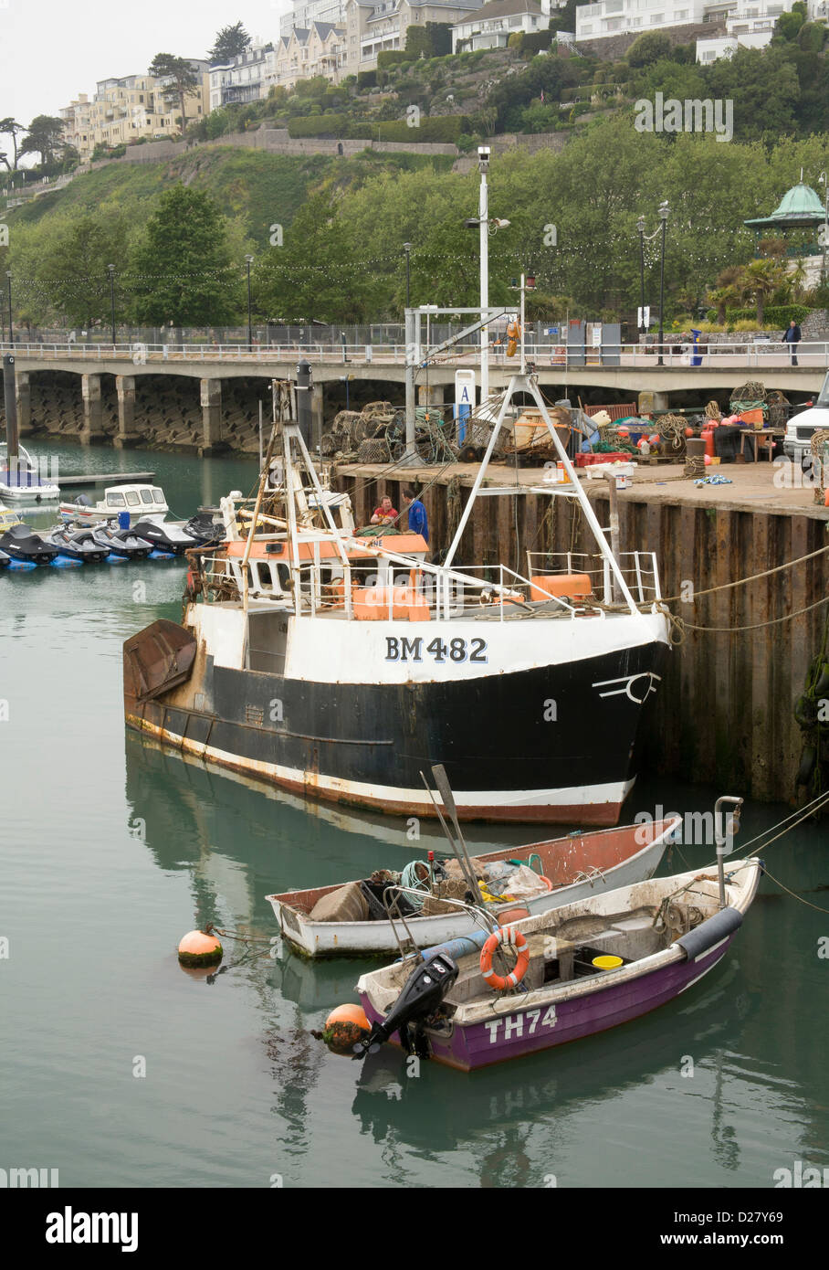 Torquay harbour quayside with fishing boat moored Stock Photo Alamy