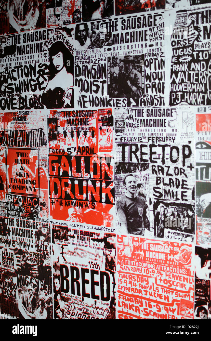 Posters advertising alternative rock bands outside a club, London, UK Stock Photo