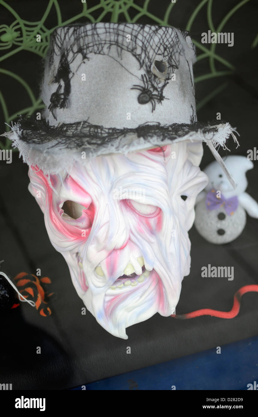 Horrific looking face promoting Halloween in a shop window Stock Photo
